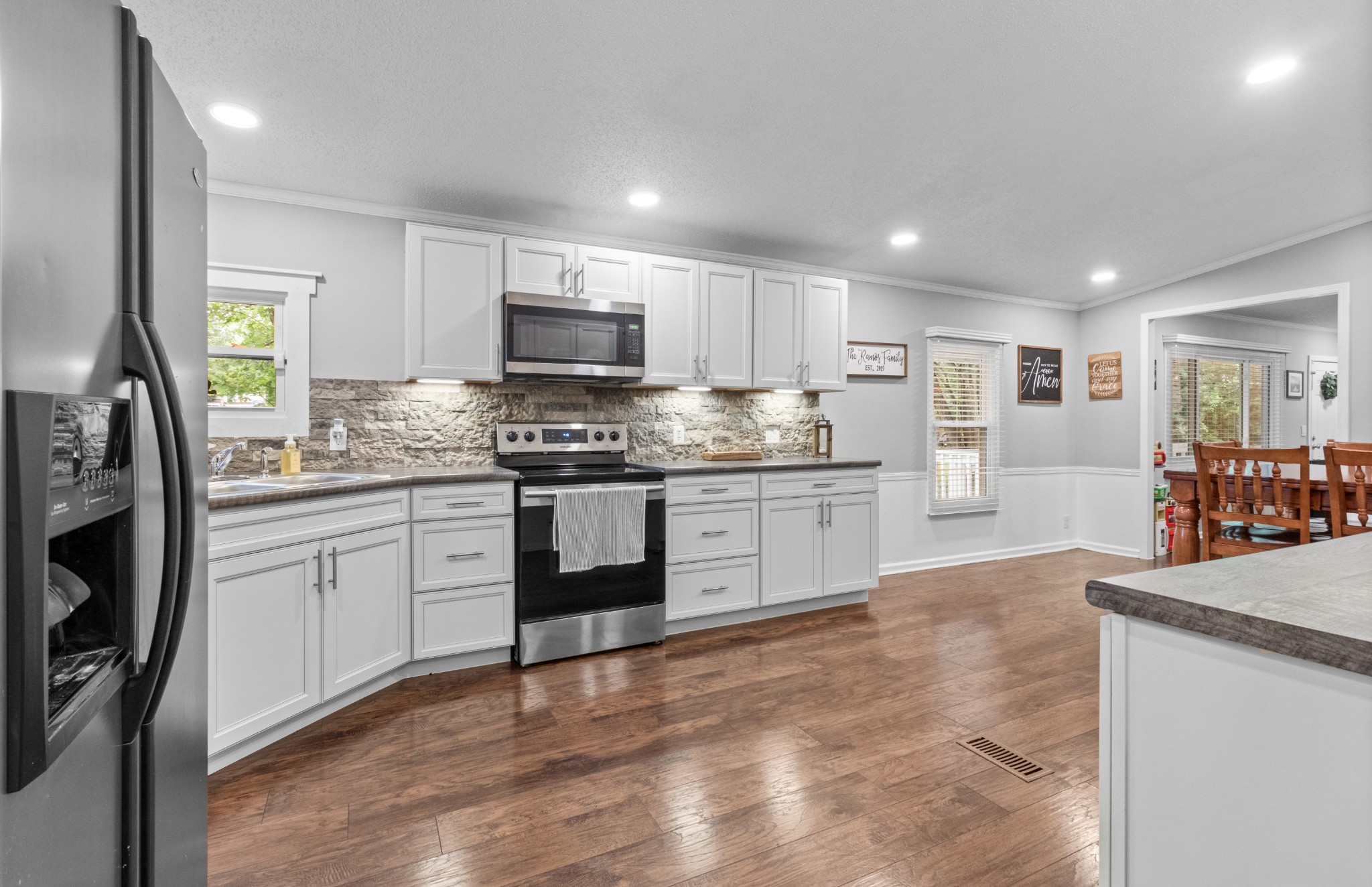 5674 Lakeview Road Springfield, TN 37172 - Photo 36 of 54 a kitchen with stainless steel appliances granite countertop a stove sink and cabinets