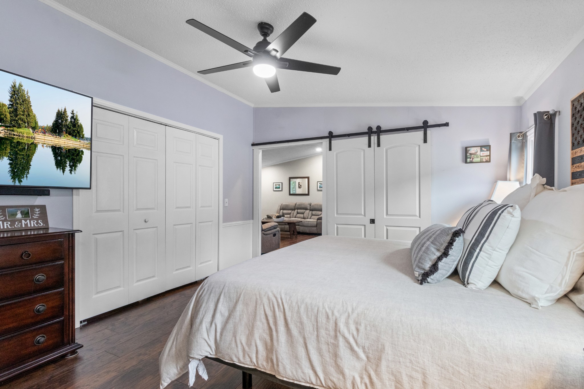 5674 Lakeview Road Springfield, TN 37172 - Photo 40 of 54 a bedroom with a large bed and a chandelier