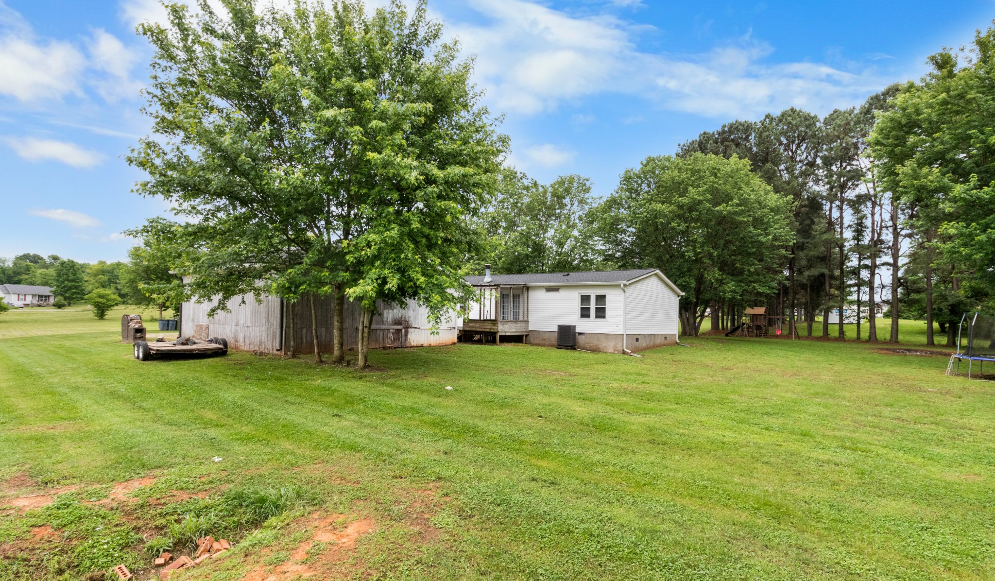 5674 Lakeview Road Springfield, TN 37172 - Photo 51 of 54 a front view of a house with a yard and trees