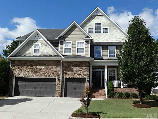 3212 Queensland Road Raleigh, NC 27614 - Photo 1 of 25 Wonderful curb appeal. Beautiful three car garage, accent stone, and well manicured landscape make this home pleasing to the eye. Notice the decorative siding is a plus for details.