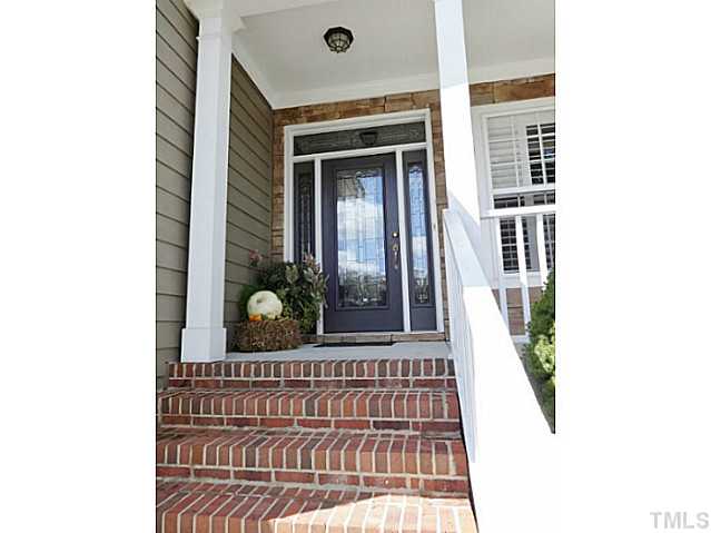 3212 Queensland Road Raleigh, NC 27614 - Photo 2 of 25 Welcome home. Inviting rocking chair front porch. Full view glass front door with side and transom windows. Decorating for any season will be absolutely stunning.