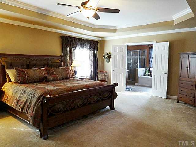 3212 Queensland Road Raleigh, NC 27614 - Photo 11 of 25 Another view of the master suite. Double doors open into your private bath.