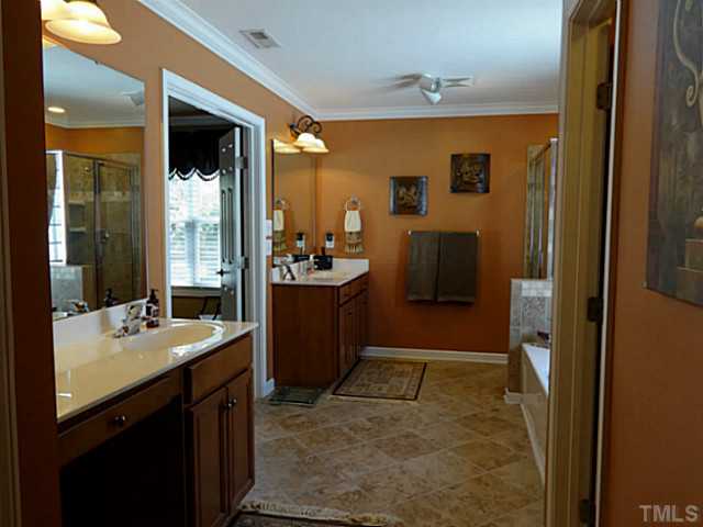 3212 Queensland Road Raleigh, NC 27614 - Photo 13 of 25 Tired of sharing one sink and vanity? Large double his and her vanities are a must. Separate water closet is provided, along with a separate linen closet. Tiled flooring is a wonderful touch to this dream spa.
