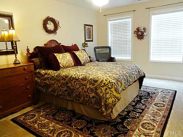 3212 Queensland Road Raleigh, NC 27614 - Photo 18 of 25 Bedroom 4. This bedroom also shares the jack-n-jill bathroom. The large closet has a small area leading to attic storage.