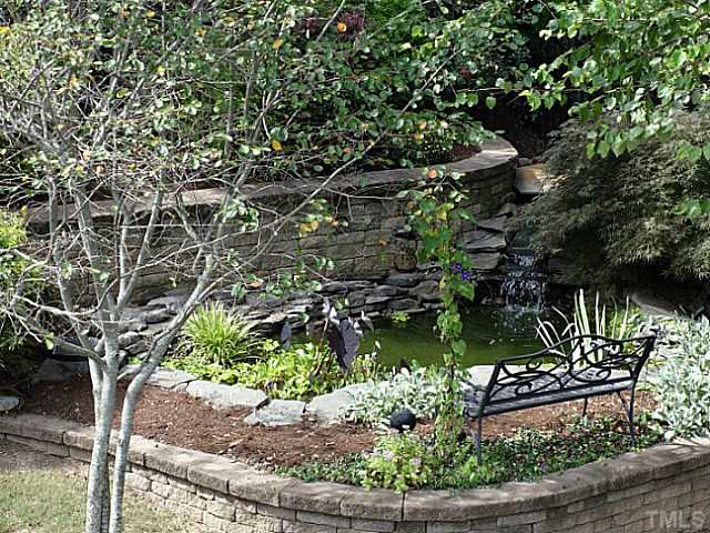 3212 Queensland Road Raleigh, NC 27614 - Photo 22 of 25 This back yard is exquisite. Need time to meditate? Relax by the Koi pond and listen to the waterfall. This area is relaxing and well designed. Imagine going to sleep to the sound of water. This is a one of a kind retreat and it backs up to a wooded area.