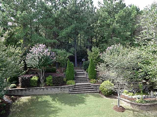 3212 Queensland Road Raleigh, NC 27614 - Photo 24 of 25 Wow! Breath taking secluded private back yard. Don't worry about the seeing the neighbors. You will be thrilled to entertain in this area. Set a table, light candles and have a romantic dinner. This is one of the most gorgeous areas you will find.