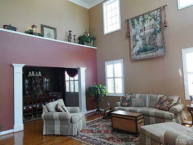 3212 Queensland Road Raleigh, NC 27614 - Photo 4 of 25 Large open space perfect for formal affairs. Windows allow plenty of sunlight. The ledge above the dining room columns has an electrical outlet for convenience. Crown molding adds just the right touch.