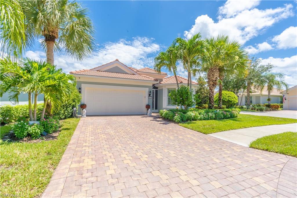 8883 Ravello Court Naples, FL 34114 - Photo 2 of 35 Mediterranean / spanish home featuring a garage