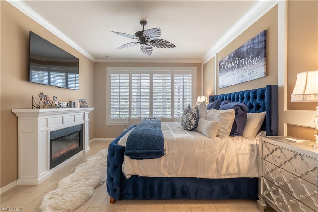 8883 Ravello Court Naples, FL 34114 - Photo 21 of 35 Bedroom featuring ceiling fan and ornamental molding