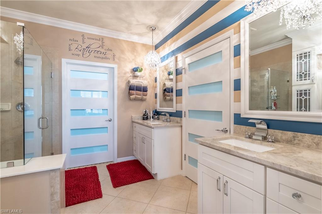 8883 Ravello Court Naples, FL 34114 - Photo 22 of 35 Bathroom with an enclosed shower, crown molding, tile patterned flooring, and dual bowl vanity