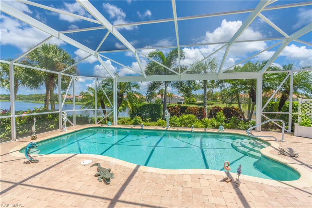 8883 Ravello Court Naples, FL 34114 - Photo 28 of 35 View of swimming pool featuring a patio and glass enclosure