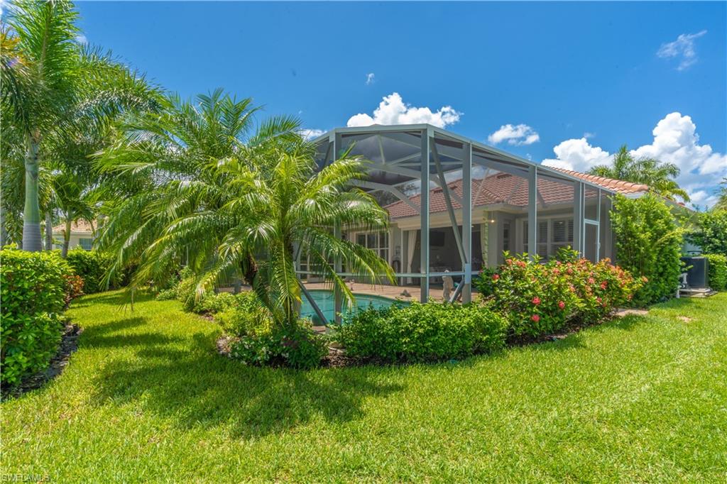 8883 Ravello Court Naples, FL 34114 - Photo 33 of 35 View of yard featuring glass enclosure