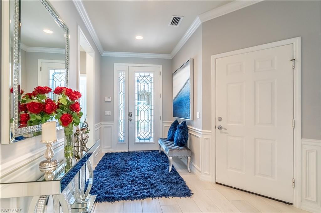 8883 Ravello Court Naples, FL 34114 - Photo 4 of 35 Foyer entrance with crown molding