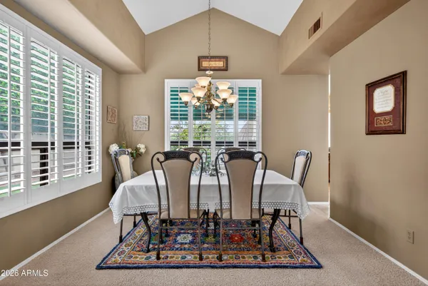 a view of a dining room with furniture