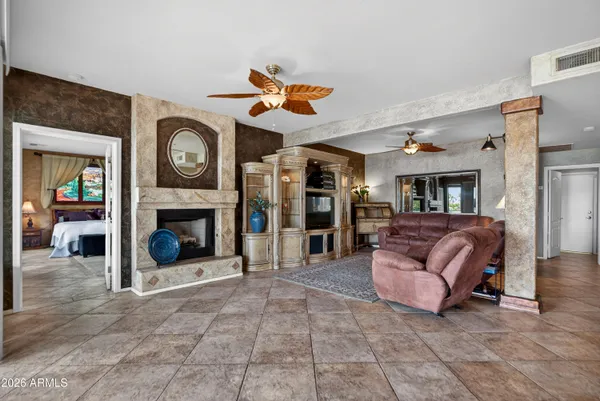a large kitchen with a table and chairs