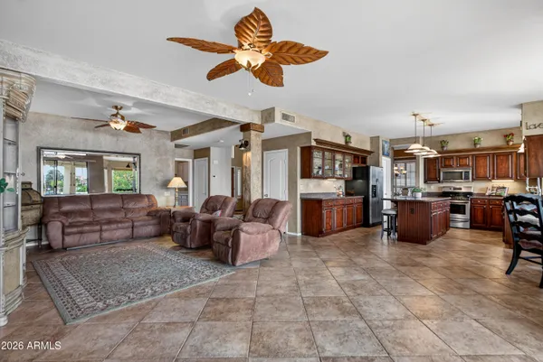 a kitchen with granite countertop a stove sink and microwave