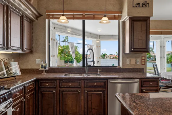 a bathroom with a double vanity sink mirror and shower