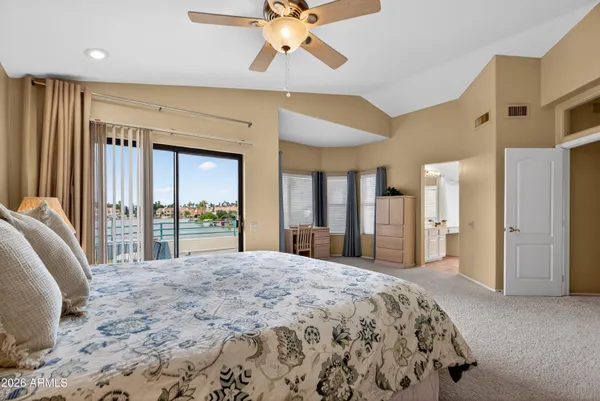 a bathroom with a granite countertop sink mirror toilet and bathtub