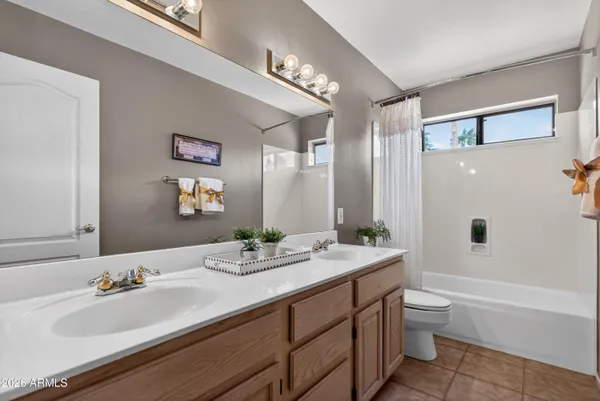 a view of a dining room with furniture large windows and wooden floor