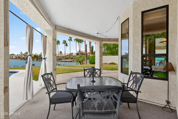 a view of a backyard with sitting area