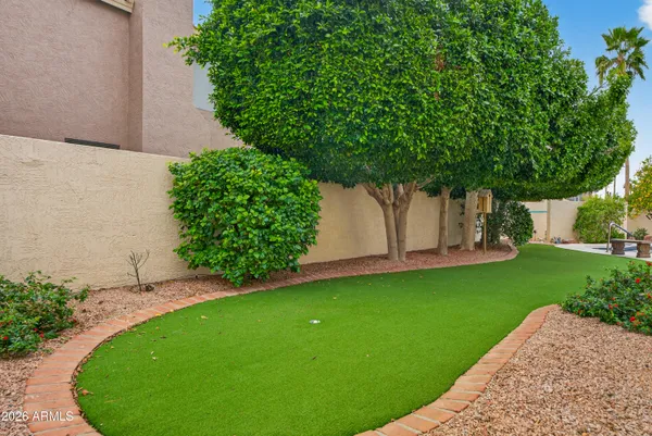 a view of a swimming pool with outdoor seating