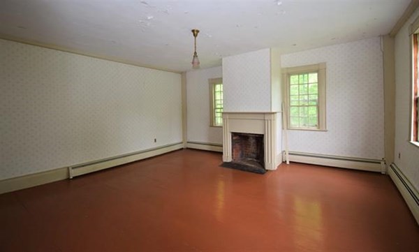 8 Old Coach Road Kingston, NH 03848 - Photo 12 of 27 an empty room with fireplace and windows