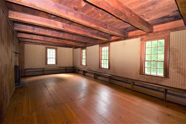 8 Old Coach Road Kingston, NH 03848 - Photo 13 of 27 a view of an empty room with wooden floor and a window
