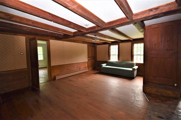 8 Old Coach Road Kingston, NH 03848 - Photo 19 of 27 a view of livingroom with furniture wooden floor and window