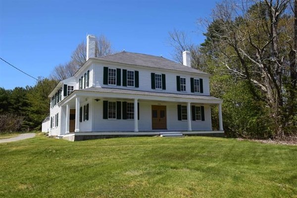 8 Old Coach Road Kingston, NH 03848 - Photo 2 of 27 a front view of a house with a garden