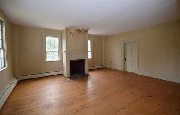 8 Old Coach Road Kingston, NH 03848 - Photo 9 of 27 an empty room with windows and fireplace