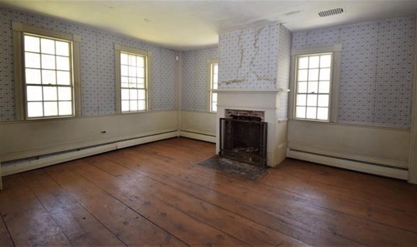 8 Old Coach Road Kingston, NH 03848 - Photo 10 of 27 an empty room with wooden floor and windows