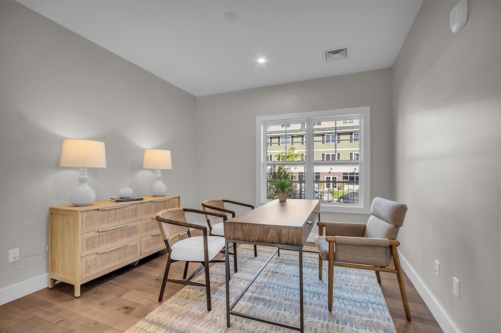 55 Pointe Place, Unit 306 Dover, NH 03820 - Photo 29 of 41 a dining room with furniture and a window