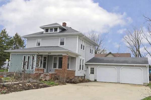 a front view of a house with yard
