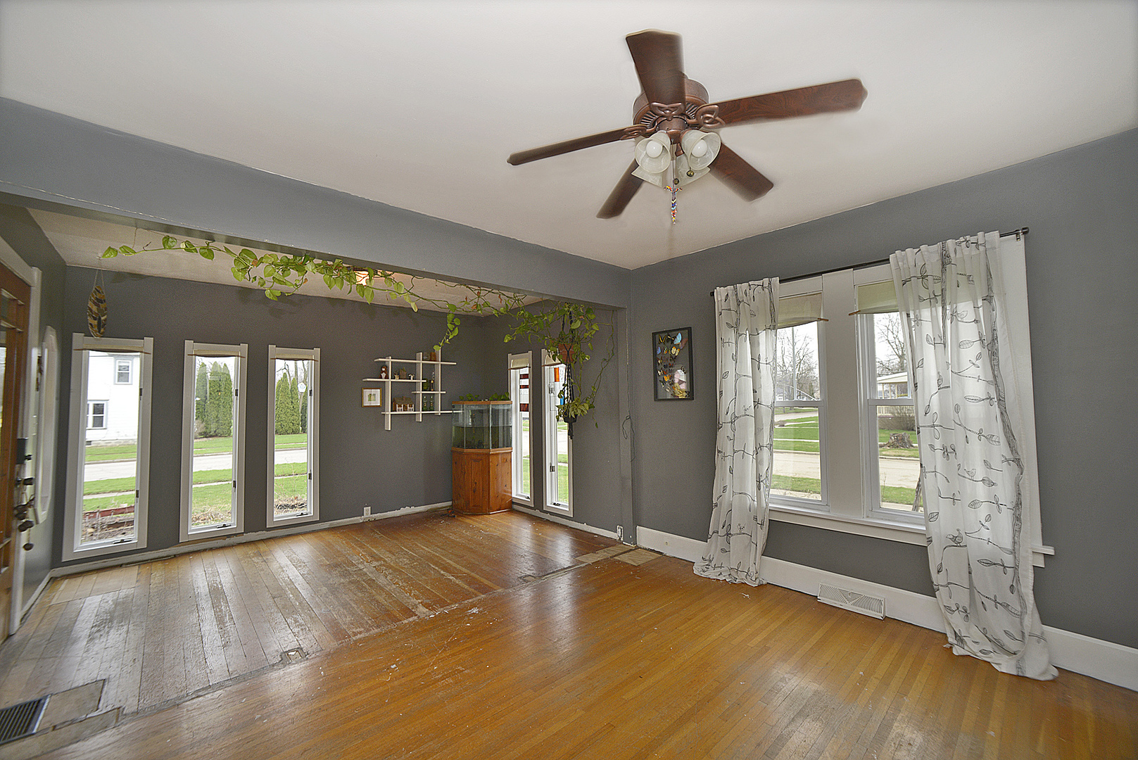 210 6th Street Mendota, IL 61342 - Photo 3 of 27 a view of an empty room with window and wooden floor