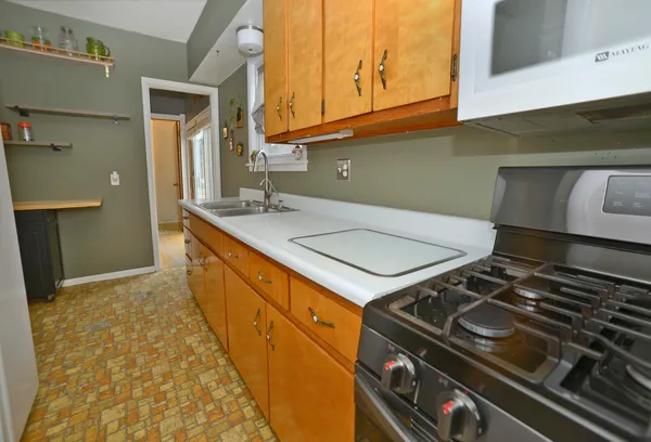 a kitchen with a stove and a sink