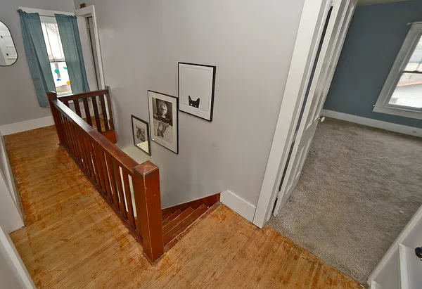 a view of staircase with railing and stairs