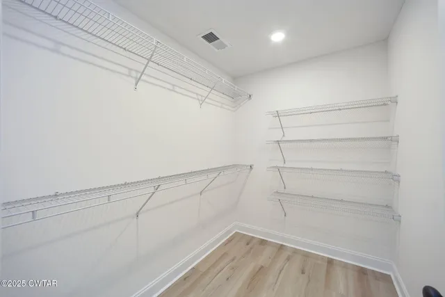 a view of a room with racks on the wall