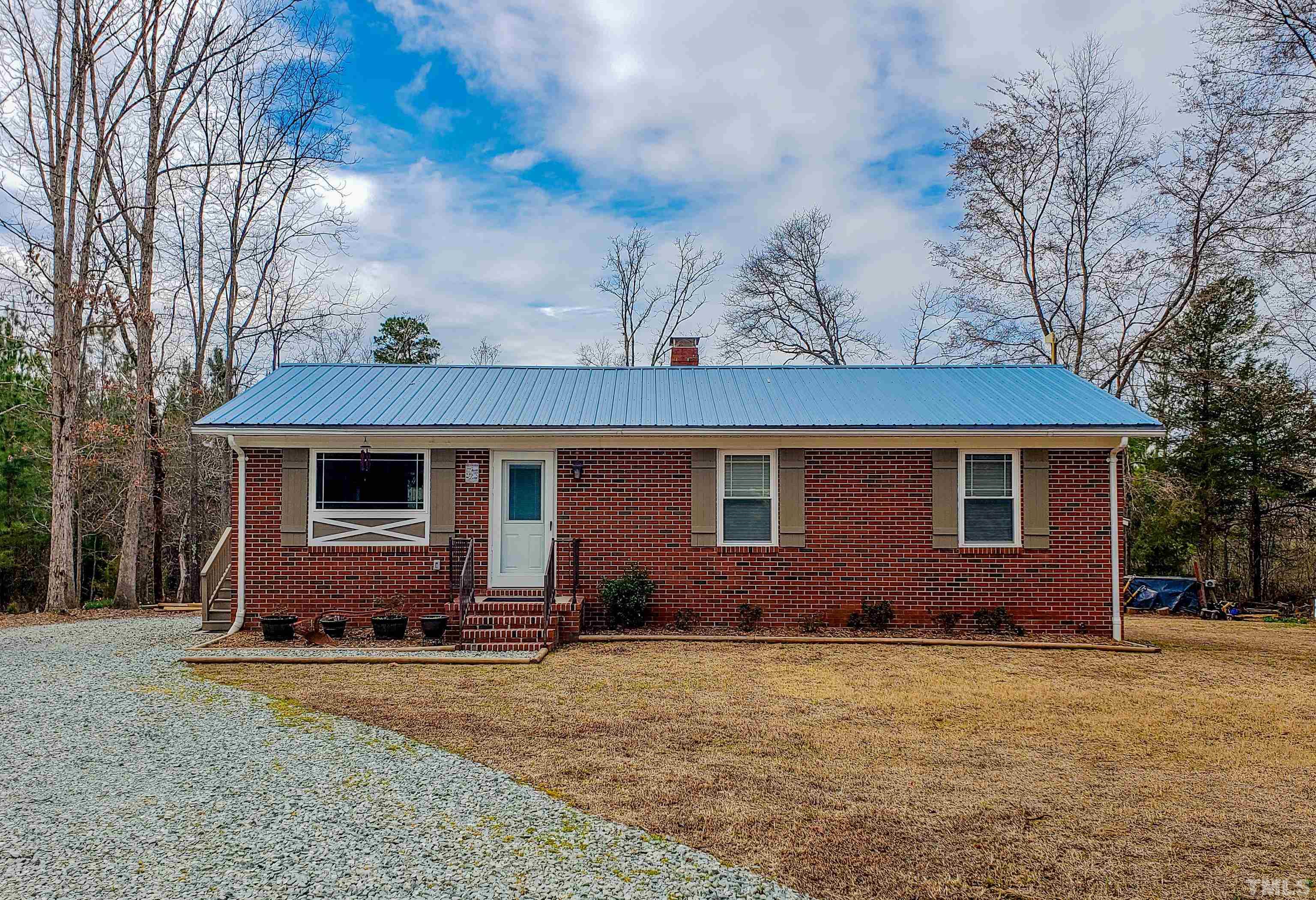 155 Alva Oakley Road Roxboro, NC 27574 - Photo 1 of 42 a view of a house with a yard