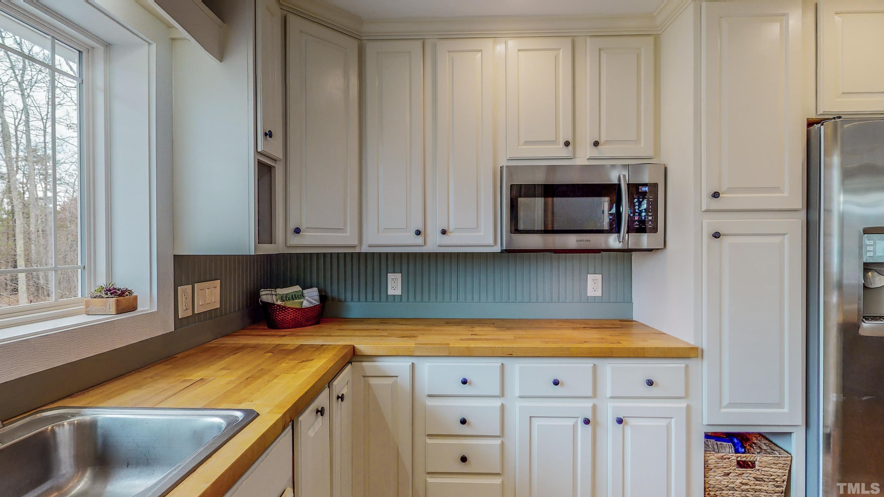 155 Alva Oakley Road Roxboro, NC 27574 - Photo 12 of 42 a kitchen with a sink cabinets and appliances