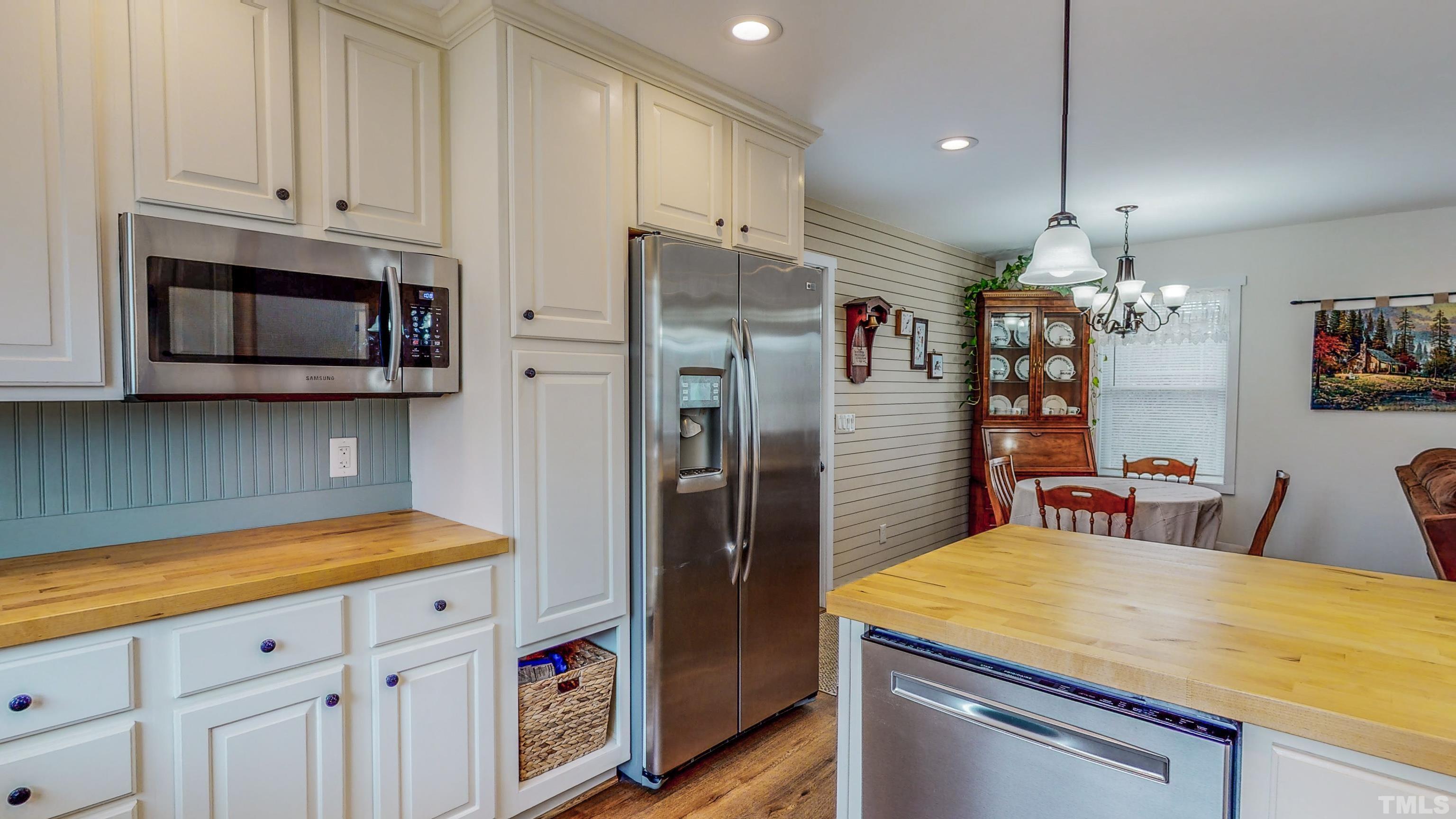 155 Alva Oakley Road Roxboro, NC 27574 - Photo 13 of 42 a kitchen that has a lot of cabinets and refrigerator