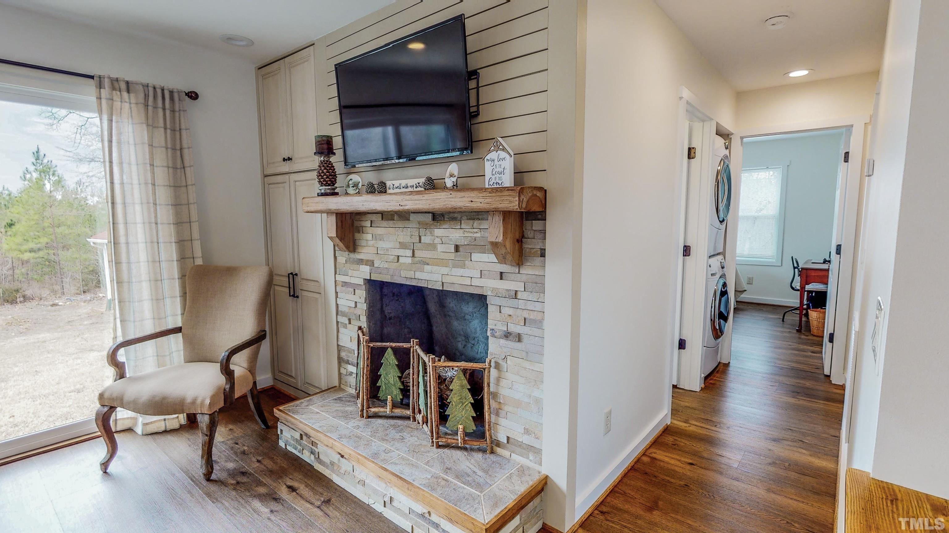 155 Alva Oakley Road Roxboro, NC 27574 - Photo 18 of 42 a view of a kitchen with furniture and a fireplace