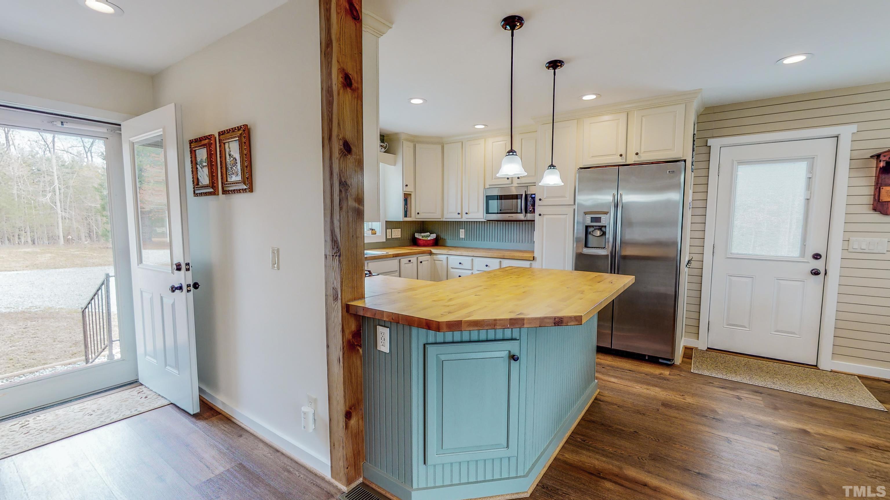 155 Alva Oakley Road Roxboro, NC 27574 - Photo 2 of 42 a kitchen with stainless steel appliances granite countertop a refrigerator a sink and a stove