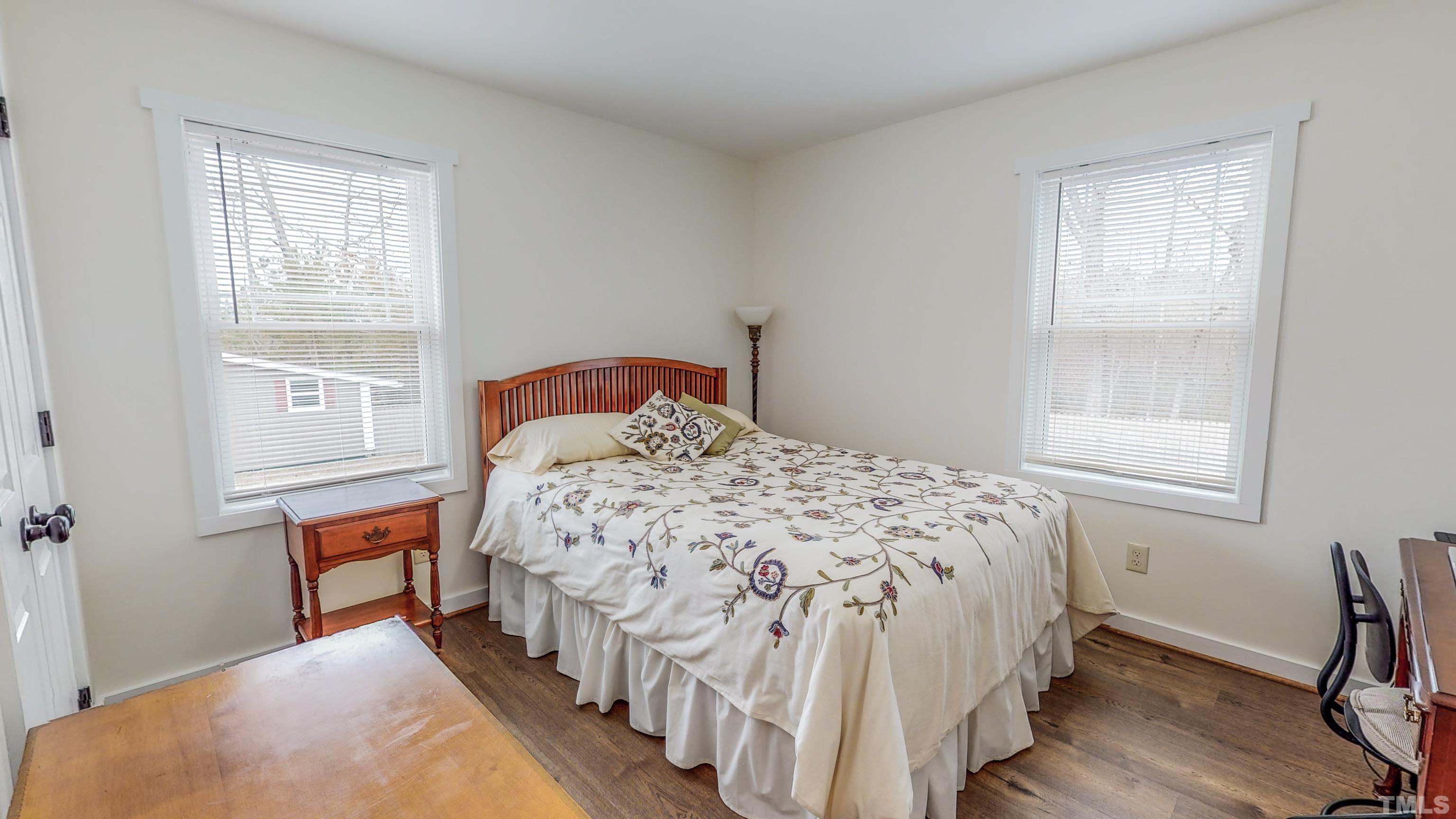 155 Alva Oakley Road Roxboro, NC 27574 - Photo 27 of 42 a bedroom with a bed next to a window