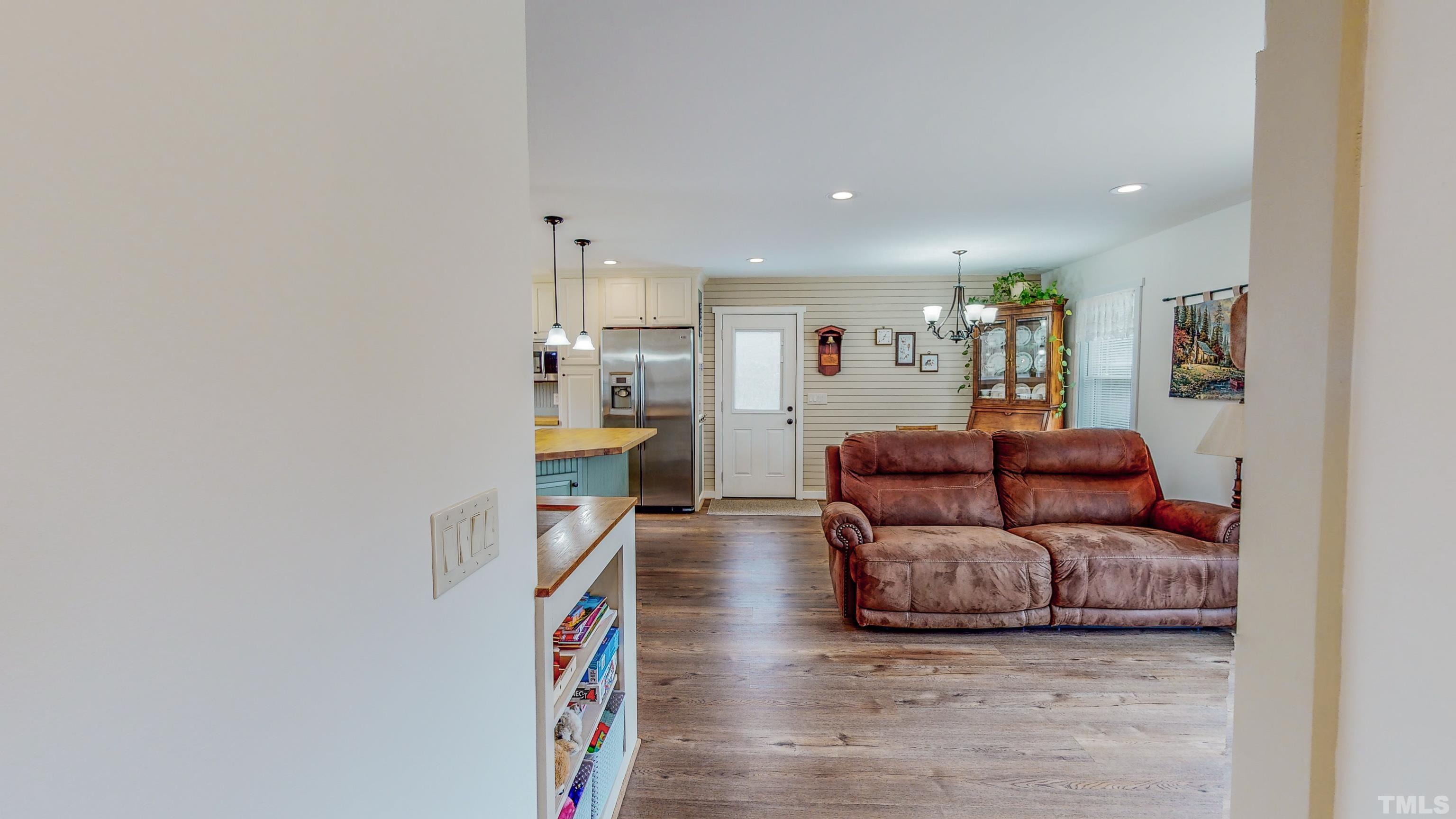 155 Alva Oakley Road Roxboro, NC 27574 - Photo 29 of 42 a living room with furniture and a flat screen tv