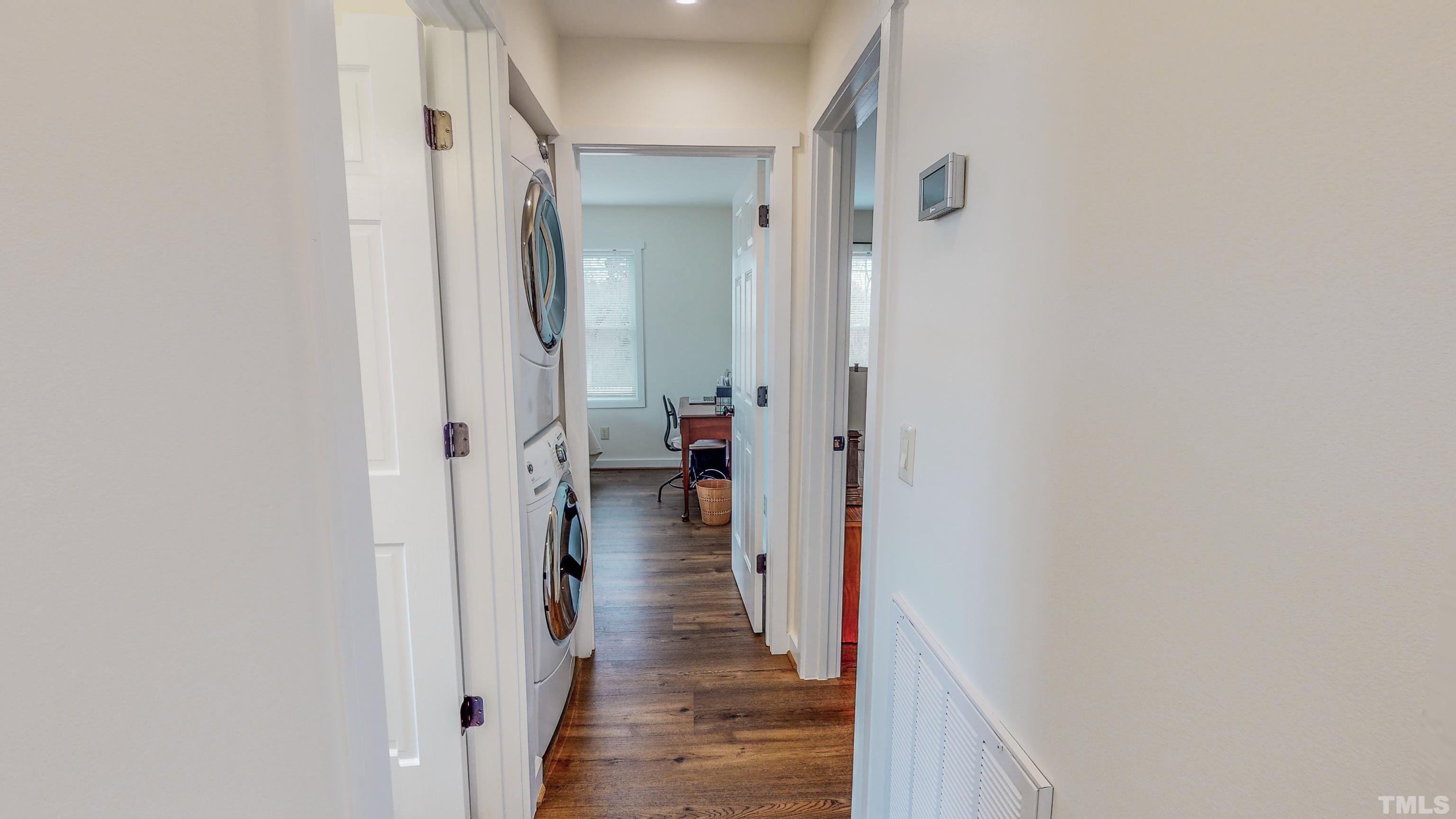 155 Alva Oakley Road Roxboro, NC 27574 - Photo 30 of 42 a view of a hallway with large mirror and wooden floor