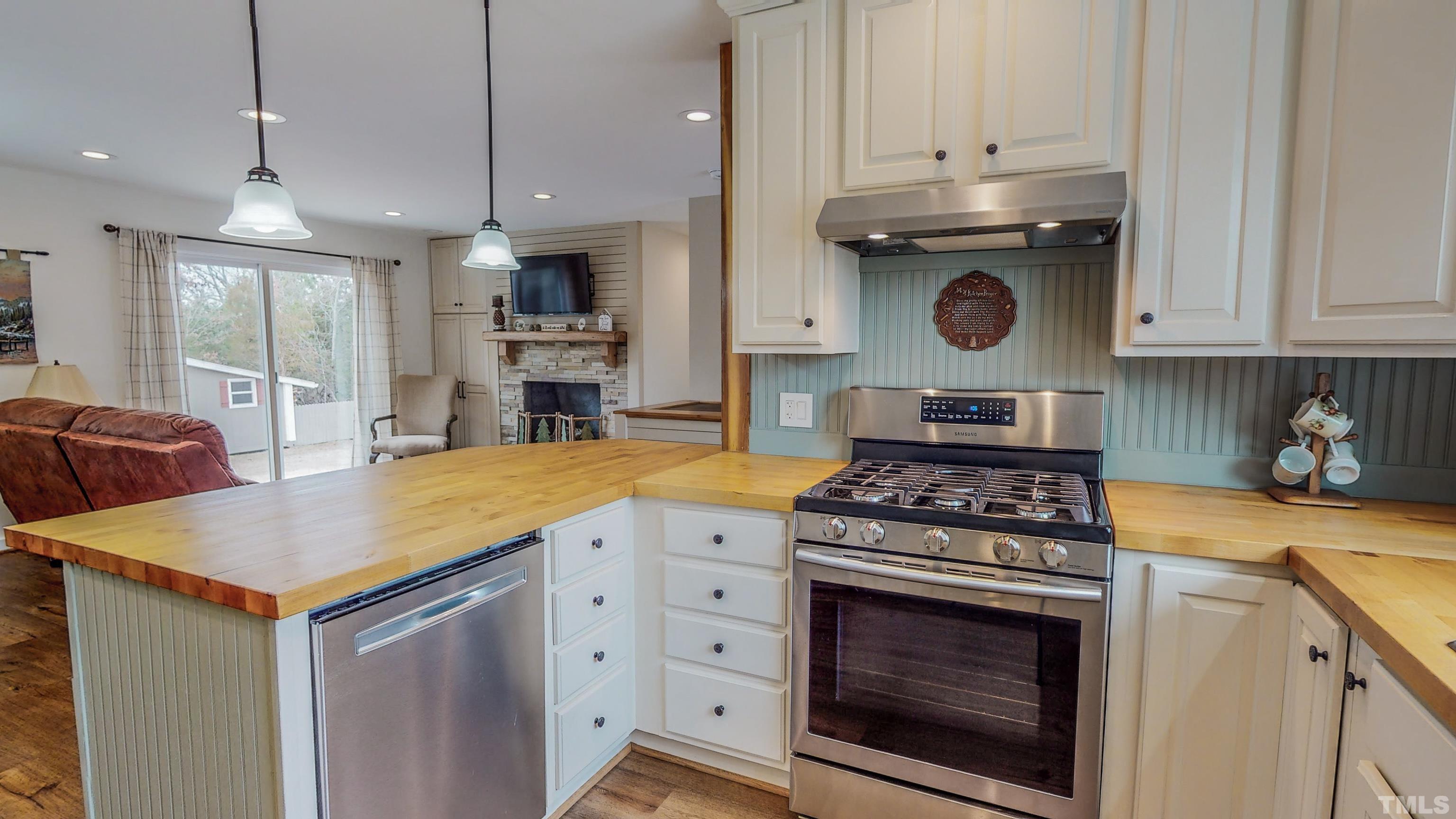 155 Alva Oakley Road Roxboro, NC 27574 - Photo 3 of 42 a kitchen with a stove and a sink