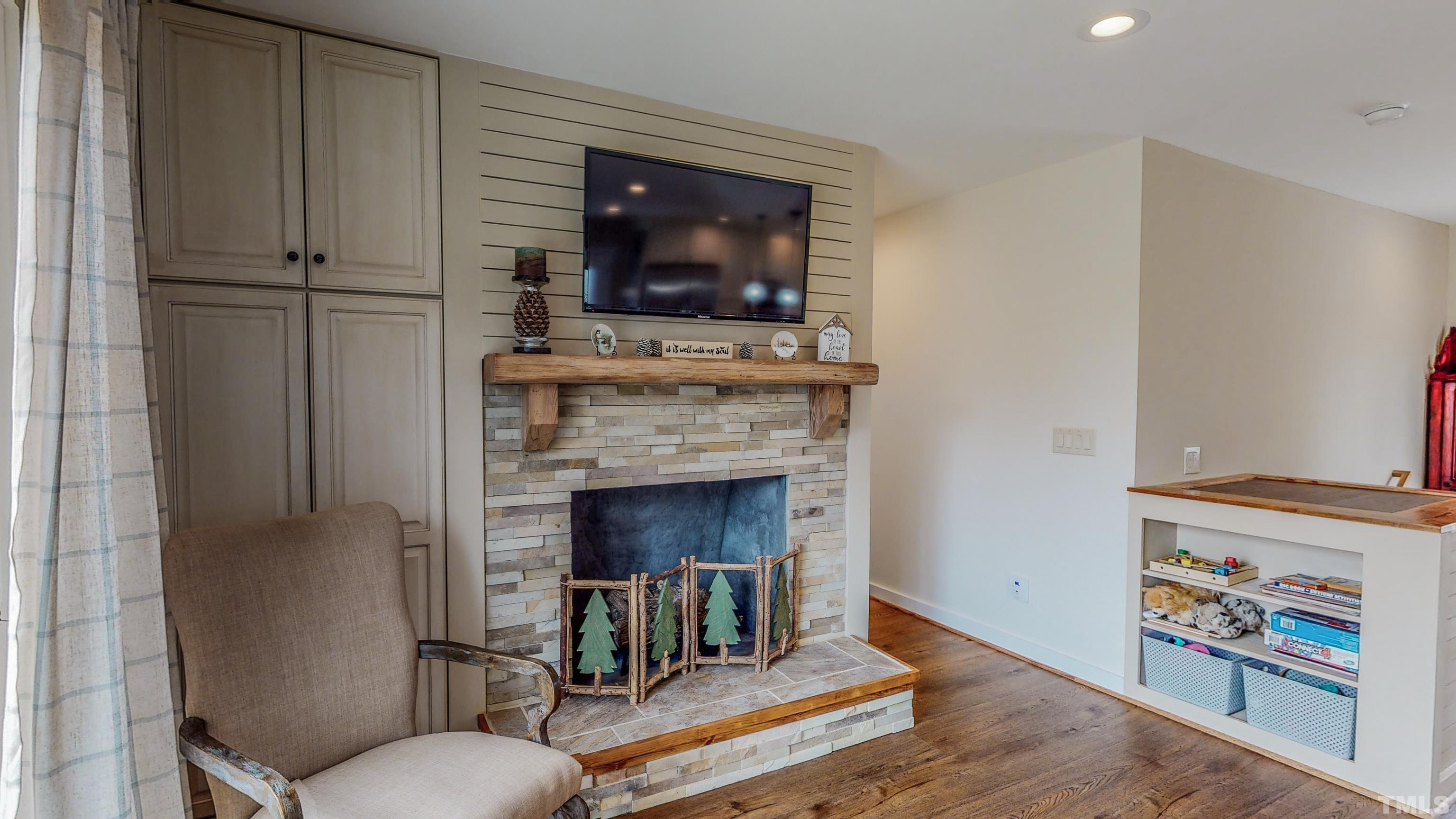155 Alva Oakley Road Roxboro, NC 27574 - Photo 31 of 42 a living room with furniture and a fireplace