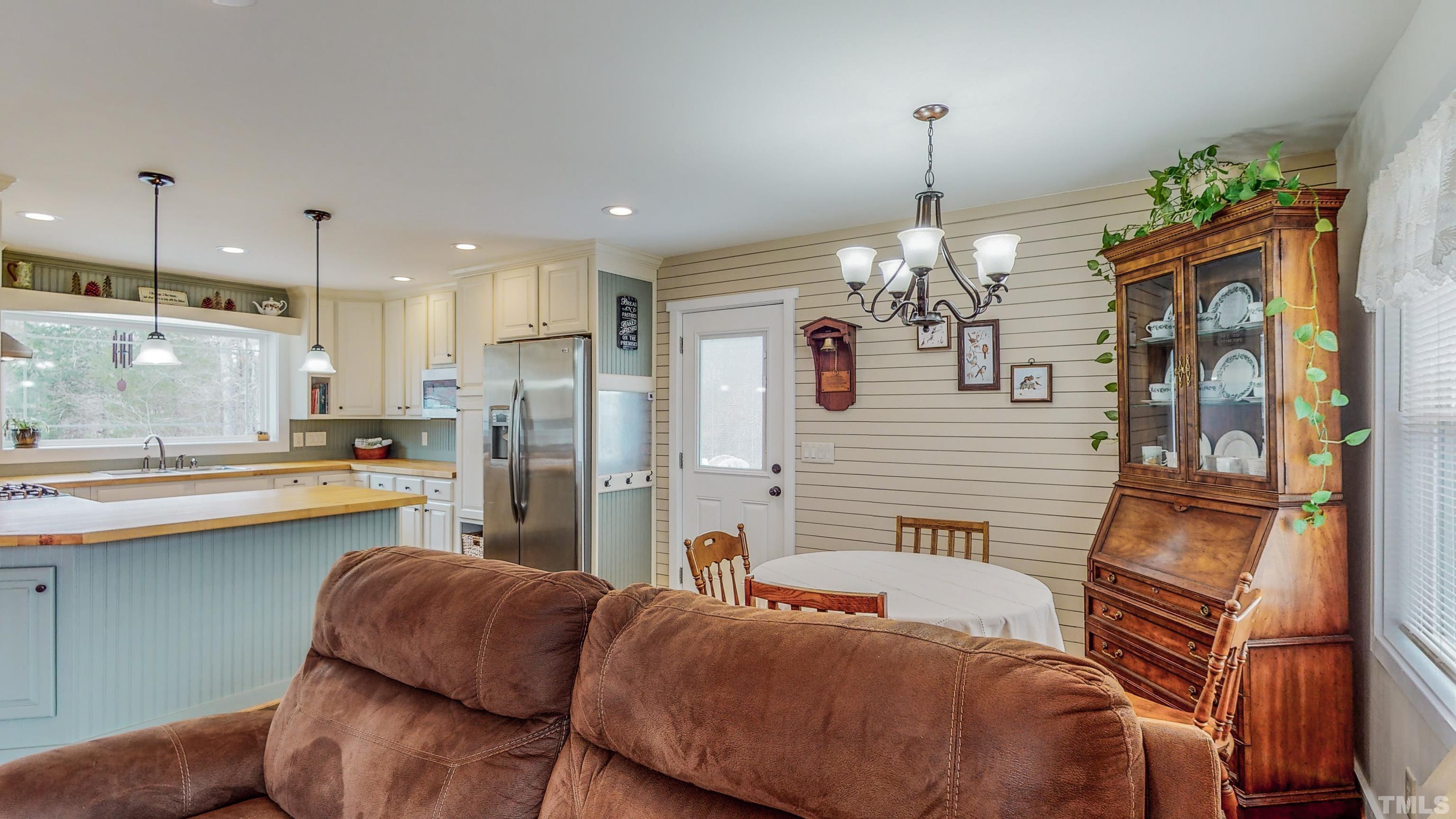 155 Alva Oakley Road Roxboro, NC 27574 - Photo 34 of 42 a kitchen with stainless steel appliances granite countertop a refrigerator and a sink