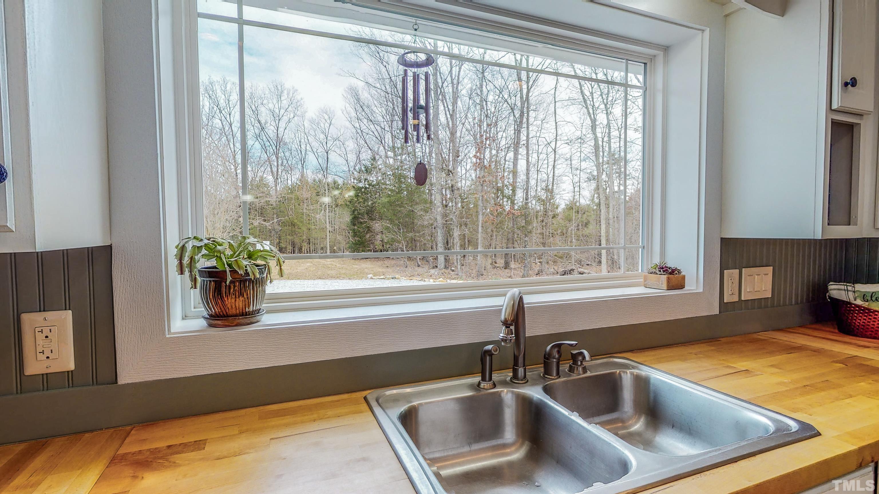 155 Alva Oakley Road Roxboro, NC 27574 - Photo 37 of 42 a bathroom with a sink and a bathtub