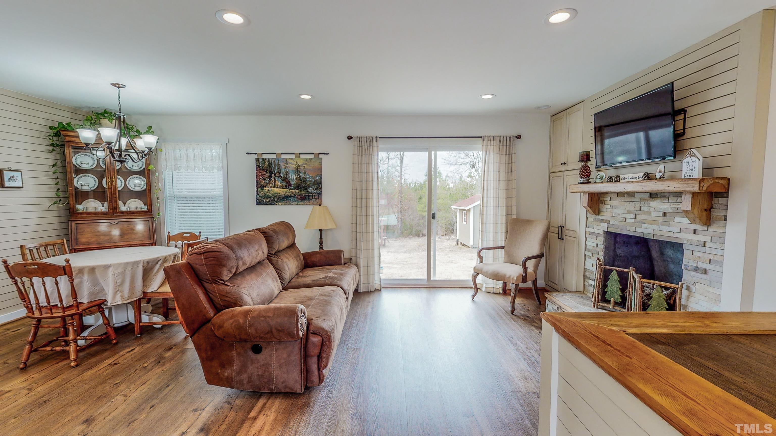 155 Alva Oakley Road Roxboro, NC 27574 - Photo 4 of 42 a living room with furniture and a fireplace